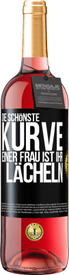 29,95 € Kostenloser Versand | Roséwein ROSÉ Ausgabe Die schönste Kurve einer Frau ist ihr Lächeln Schwarzes Etikett. Anpassbares Etikett Junger Wein Ernte 2023 Tempranillo