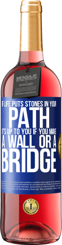 29,95 € Free Shipping | Rosé Wine ROSÉ Edition If life puts stones in your path, it's up to you if you make a wall or a bridge Blue Label. Customizable label Young wine Harvest 2024 Tempranillo