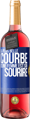 29,95 € Envoi gratuit | Vin rosé Édition ROSÉ La plus belle courbe d'une femme est son sourire Étiquette Bleue. Étiquette personnalisable Vin jeune Récolte 2023 Tempranillo