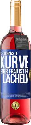 29,95 € Kostenloser Versand | Roséwein ROSÉ Ausgabe Die schönste Kurve einer Frau ist ihr Lächeln Blaue Markierung. Anpassbares Etikett Junger Wein Ernte 2023 Tempranillo