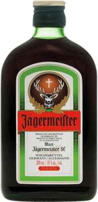 7,95 € Spedizione Gratuita | Liquore alle erbe Mast Jägermeister Germania Piccola Bottiglia 20 cl