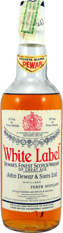 44,95 € Spedizione Gratuita | Whisky Blended Dewar's White Label Esemplare da Collezione anni '70 Regno Unito Bottiglia 75 cl